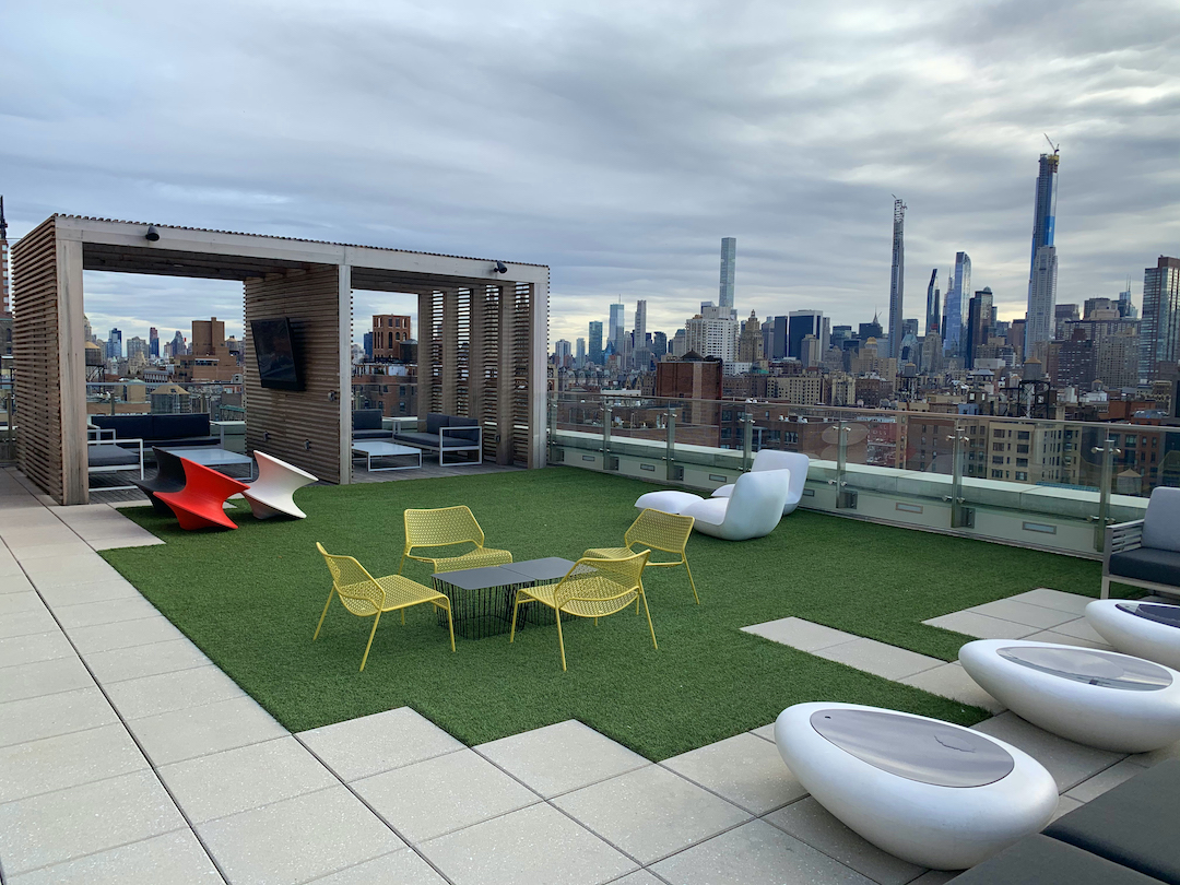 Rooftop paving system in a multifamily housing community.