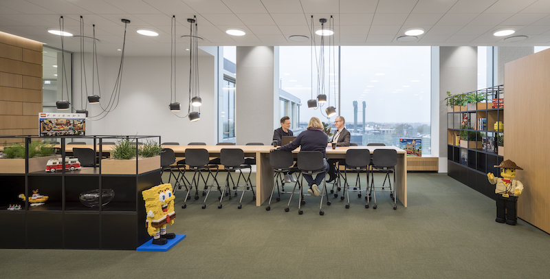 Figures made of LEGO in a gathering space in the new LEGO campus