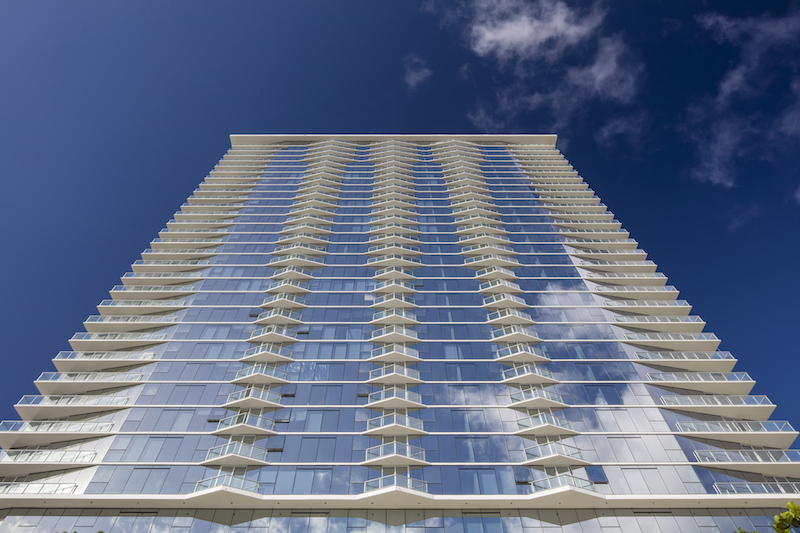 A high-rise hotel shot from below