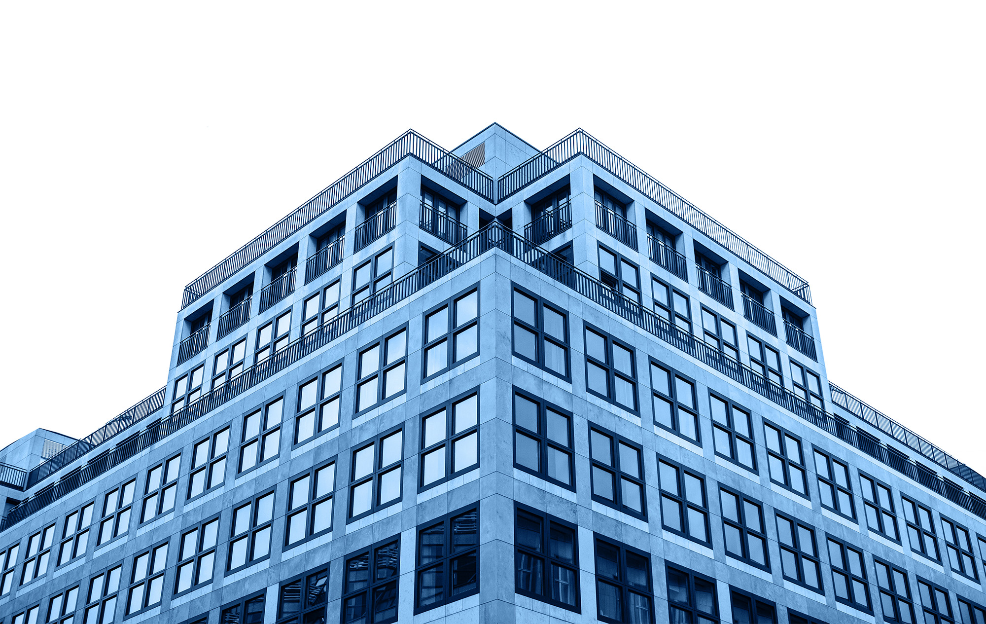 A residential building in trendy classic blue color with cut out sky with white isolated background.