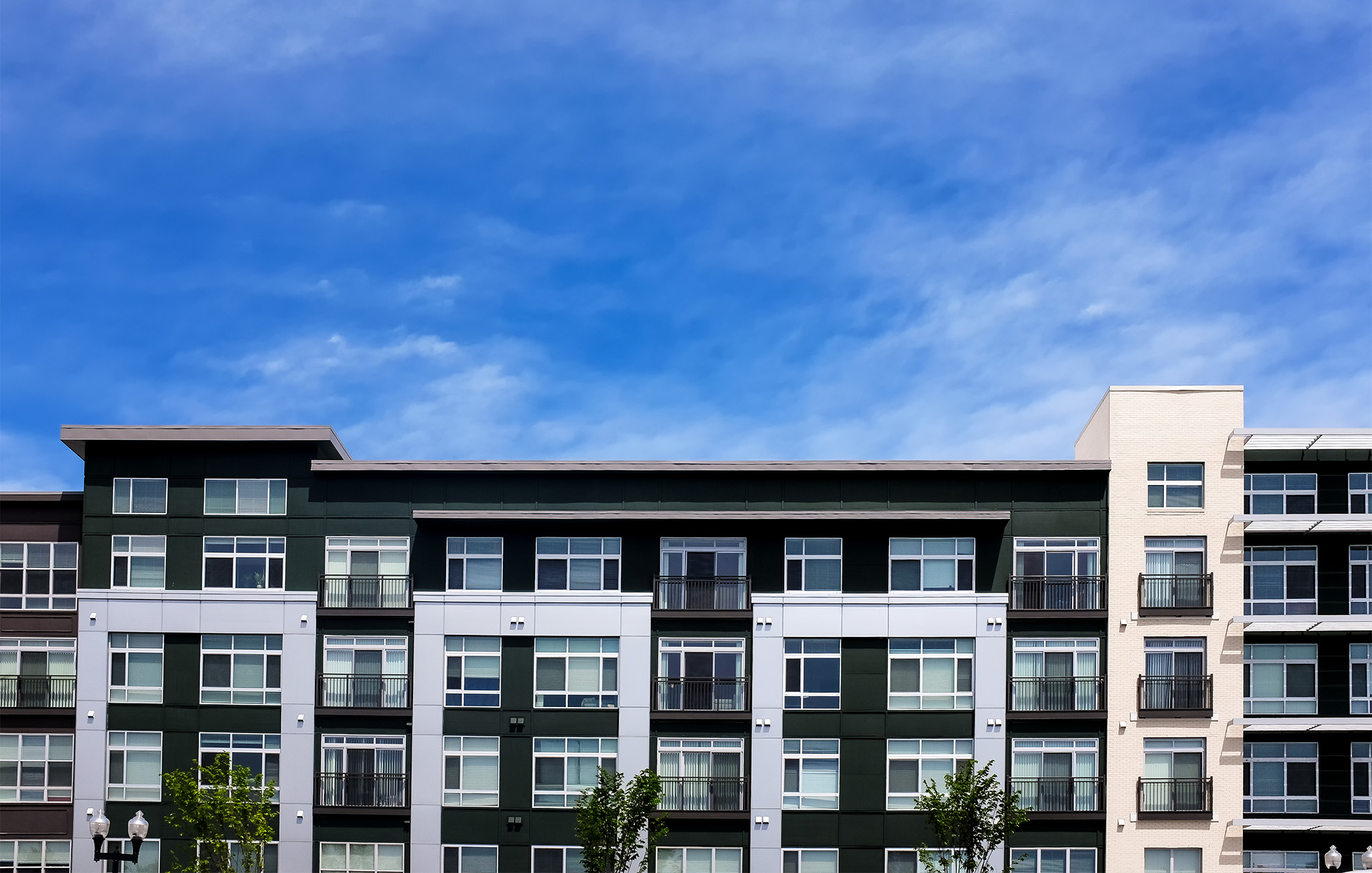 Modern apartment buildings on a sunny day with a blue sky