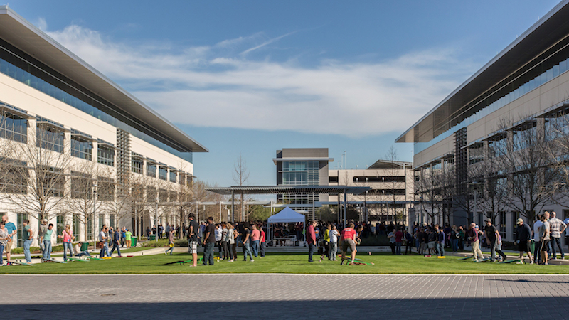 Employees in green space at apple's current Austin location