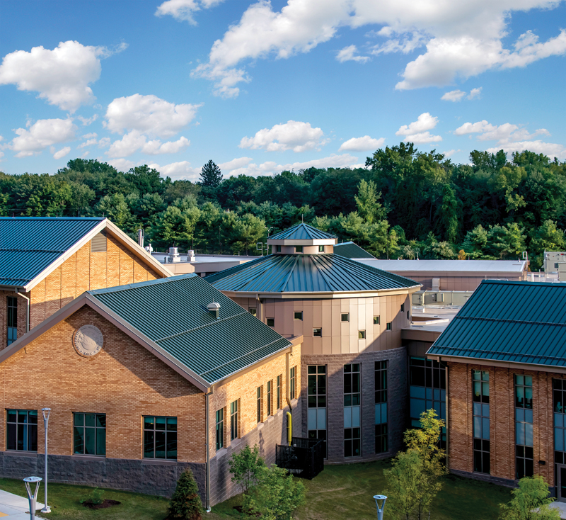 New school blends with local architecture using Petersen metal roof