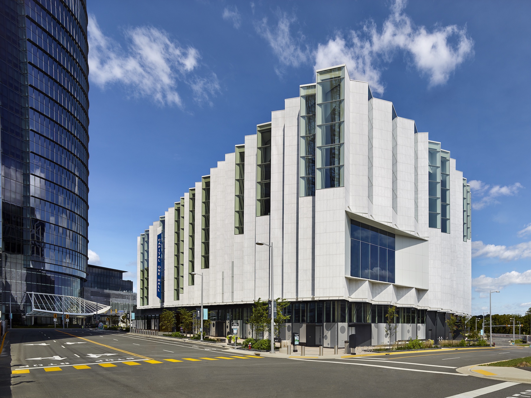 Capital One Hall's exterior features marble cladding and soaring windows.