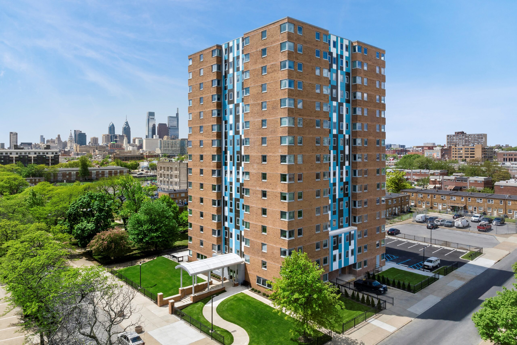 Wide corner view of affordable housing development Harrison Plaza