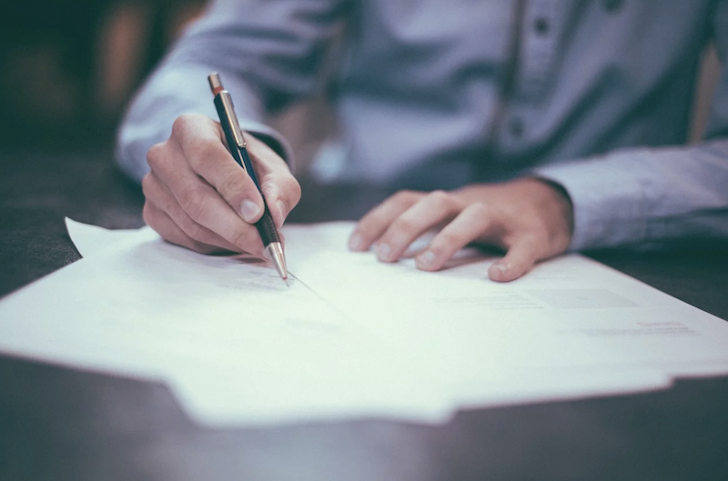 Man writing a document