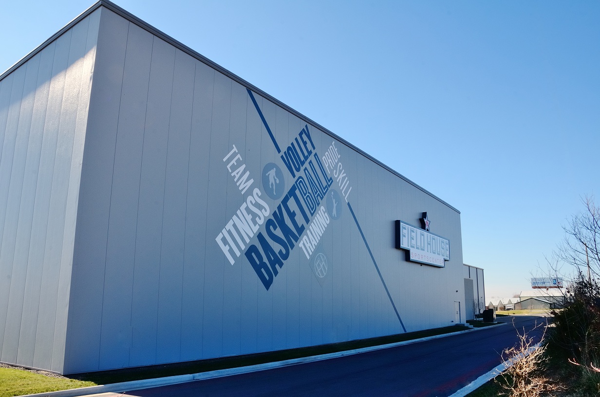 Two separate metal gym buildings accommodate a total of four full-size basketbal