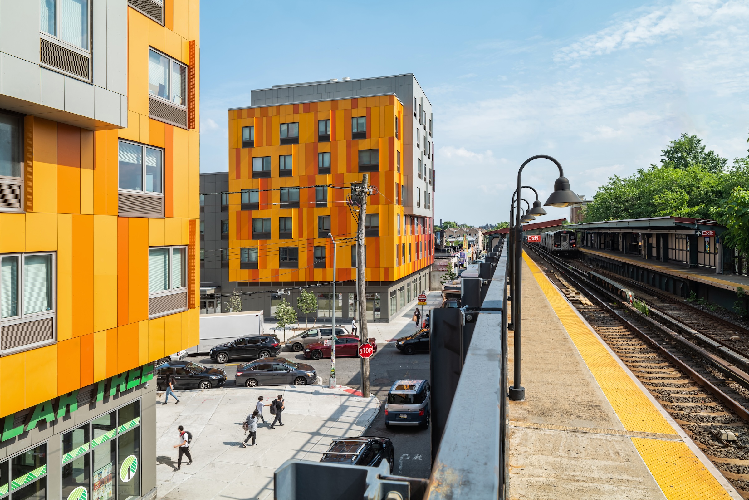 Brooklyn's colorful Van Sinderen Plaza affordable housing project includes retail, public spaces. Photo courtesy GLUCK+