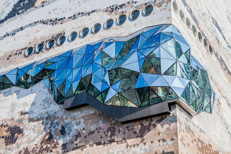 Close up of glass facade and stone