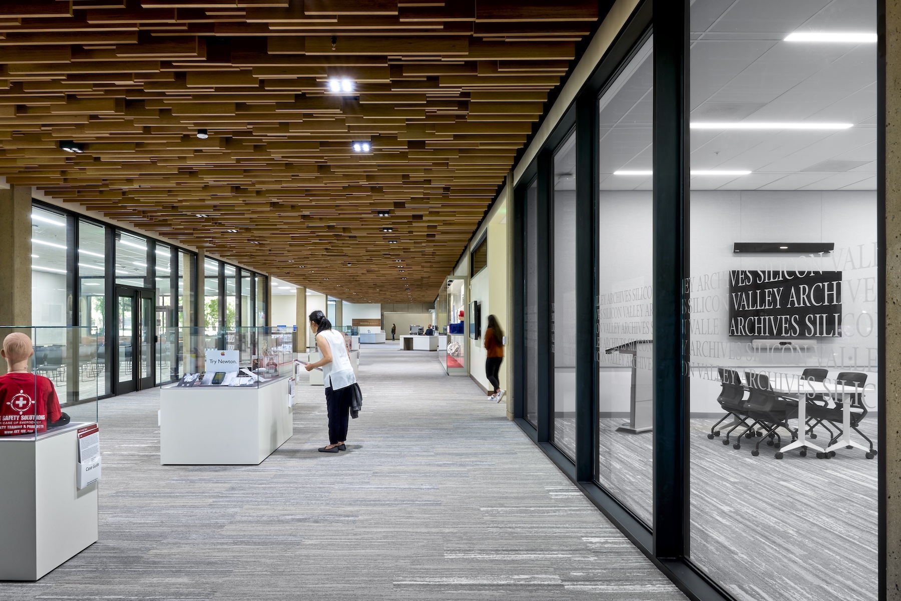 Walnut ceiling that resembles a sine wave in main corridor of Green Library's renovated East Wing