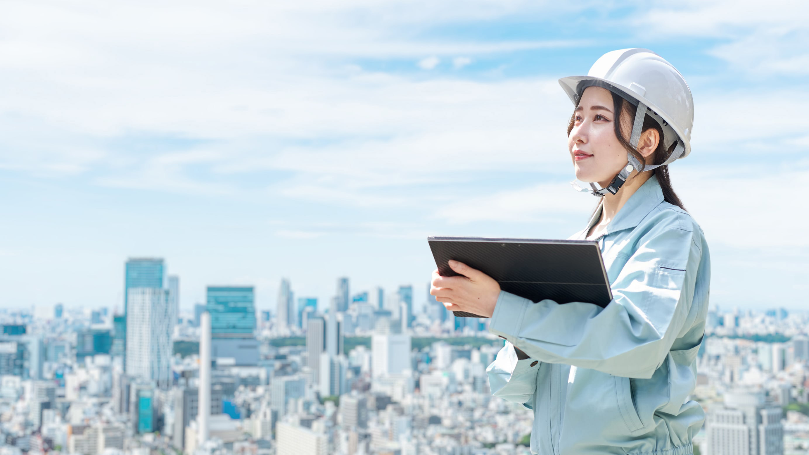 Construction worker against the backdrop of the city