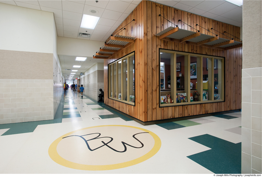 Rubber floor tiles in 24x24-inch modules were water-jet cut to accommodate custo