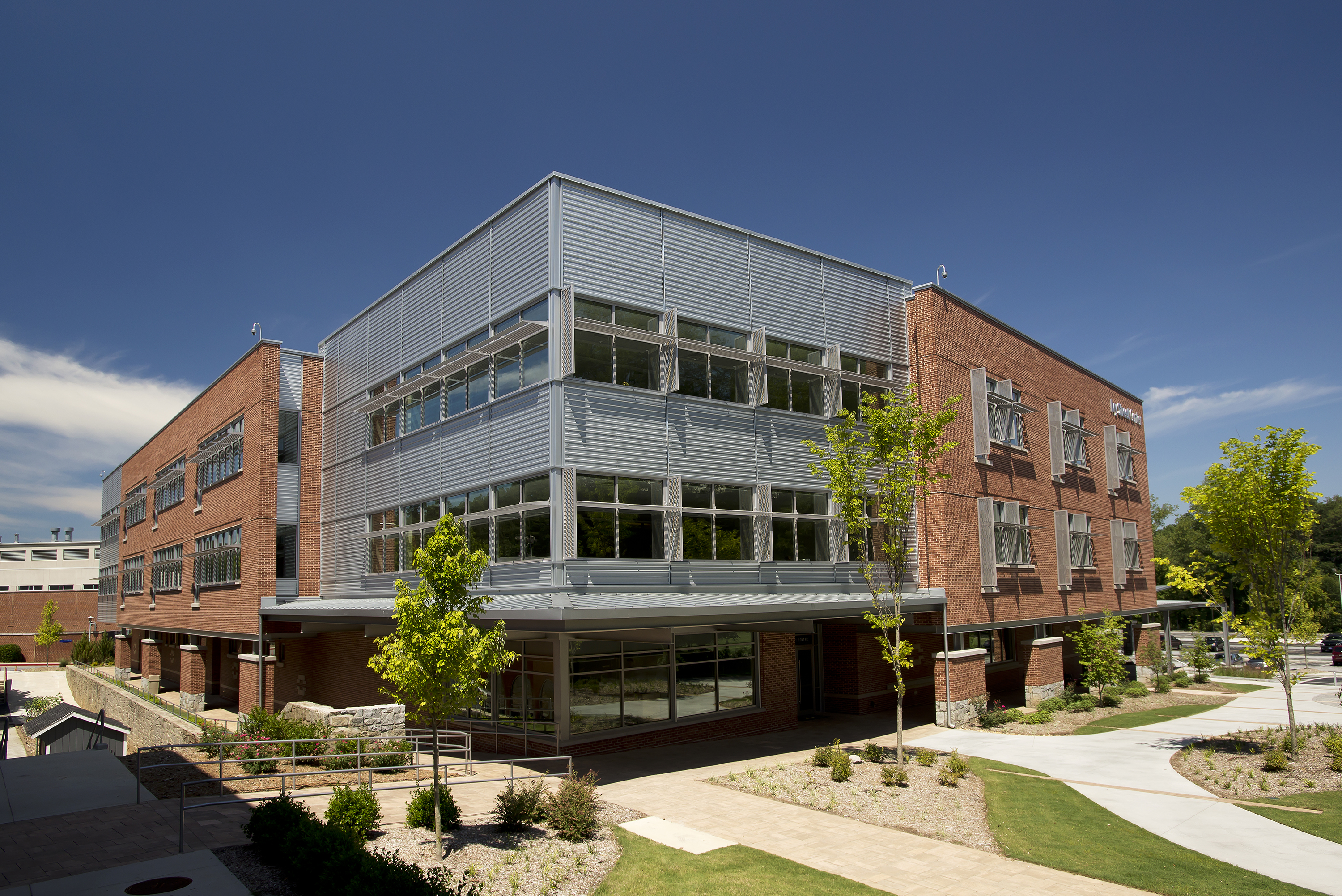 Metal wall panels’ deep shadow lines break up massing of Georgia school