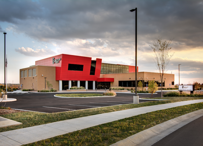 The exterior of a building clad in metal panels