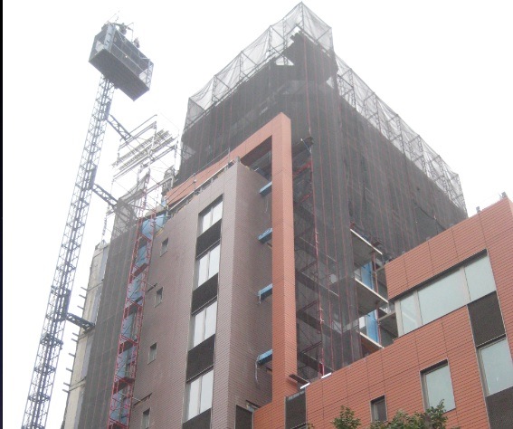 Installation of a facade panel system that uses a rainscreen approach to control