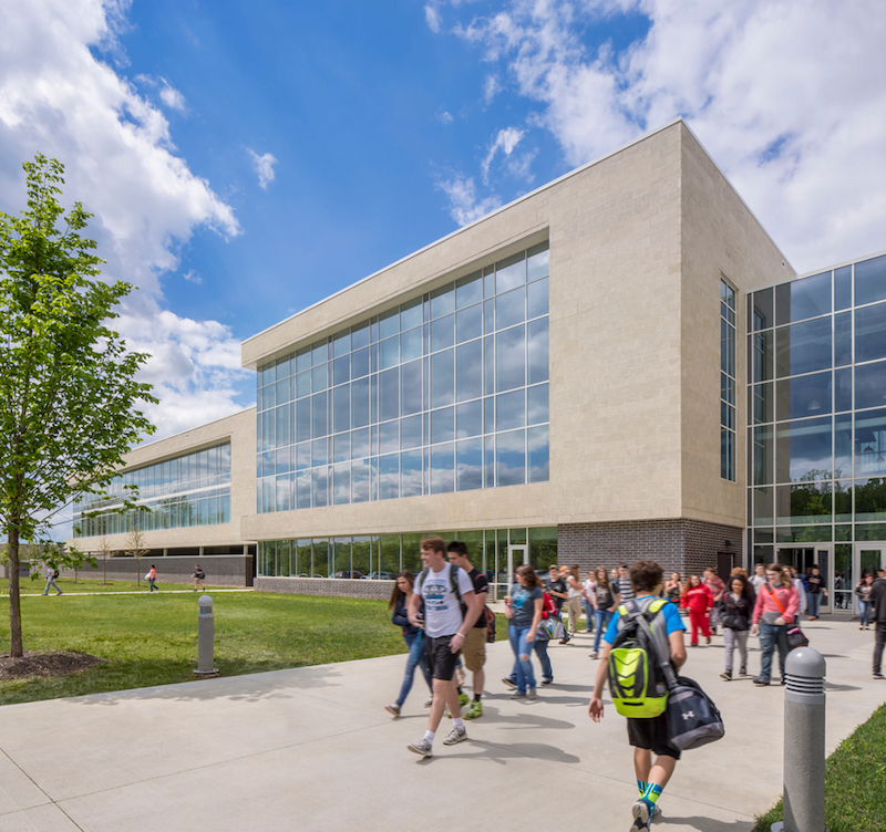 Kids walking outside of a school