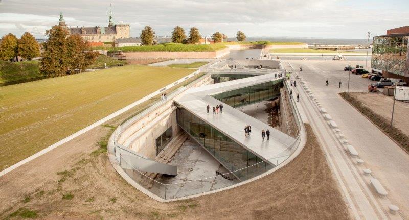 A series of three double-level bridges spans the dry dock, serving both as an ur