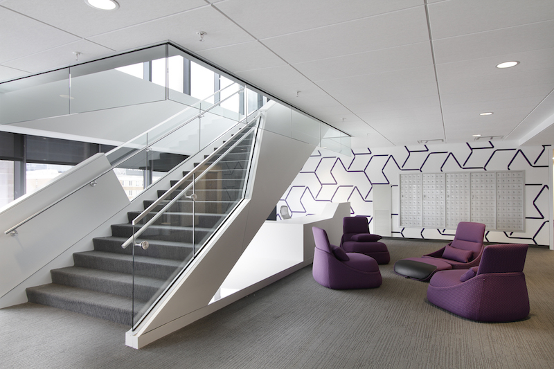 A breakout space near the stairs in the new Recreation and Student Center at STLCOP