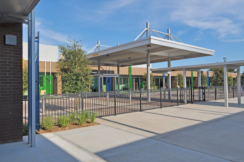 ​View from multipurpose room across Boulevard towards Building C Entry at the Awty International School in Houston