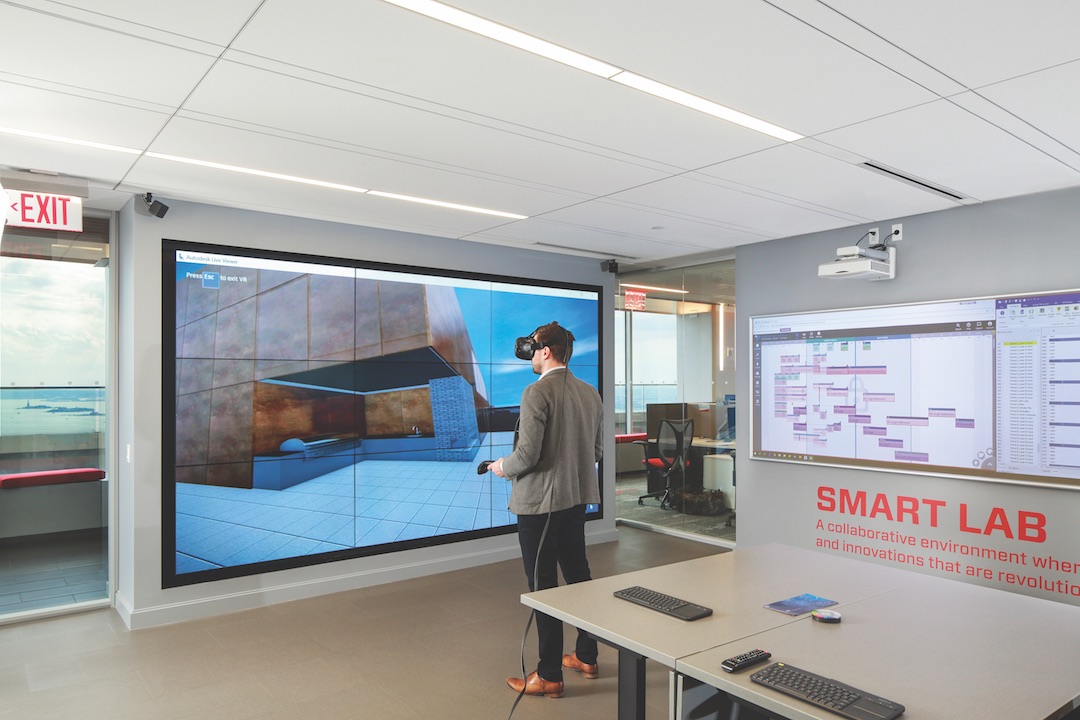 A Suffolk Construction team member explores one of the firm’s projects using a CAVE virtual reality setup