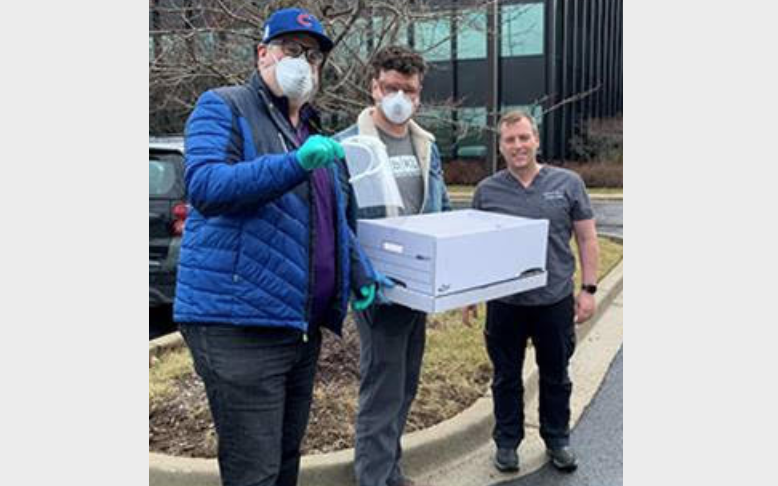 University of Chicago Medical Center staffer (and Cubs fan) takes delivery from bKL