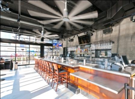 Garage doors surround the four season patio, which also features large stainless