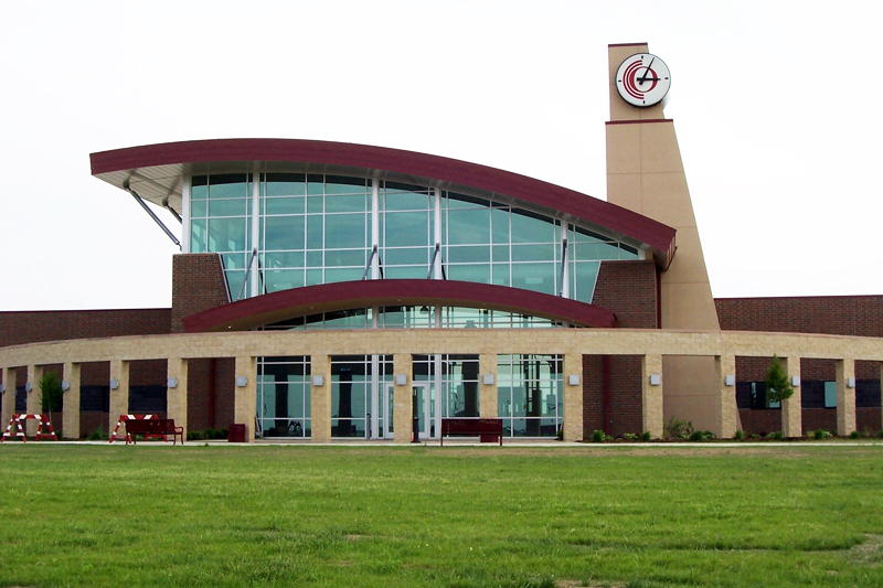 Curved metal panels give roof over community college expansion