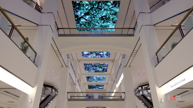 The digital display showing trees swaying in the breeze at 900 North Michigan Shops