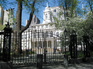 City Hall, as viewed through historic City Hall Park . Designed by architects Jo