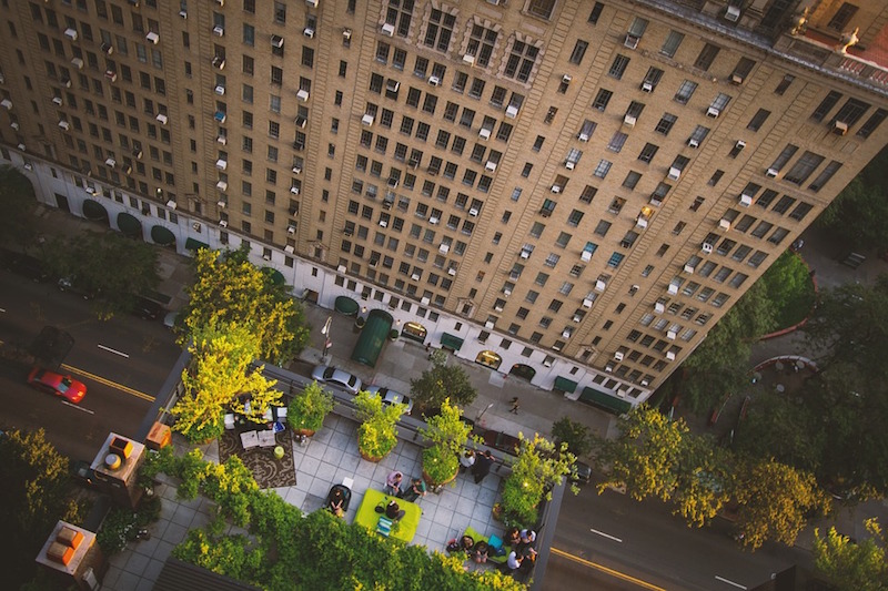 Looking down onto a rooftop terrace in the city