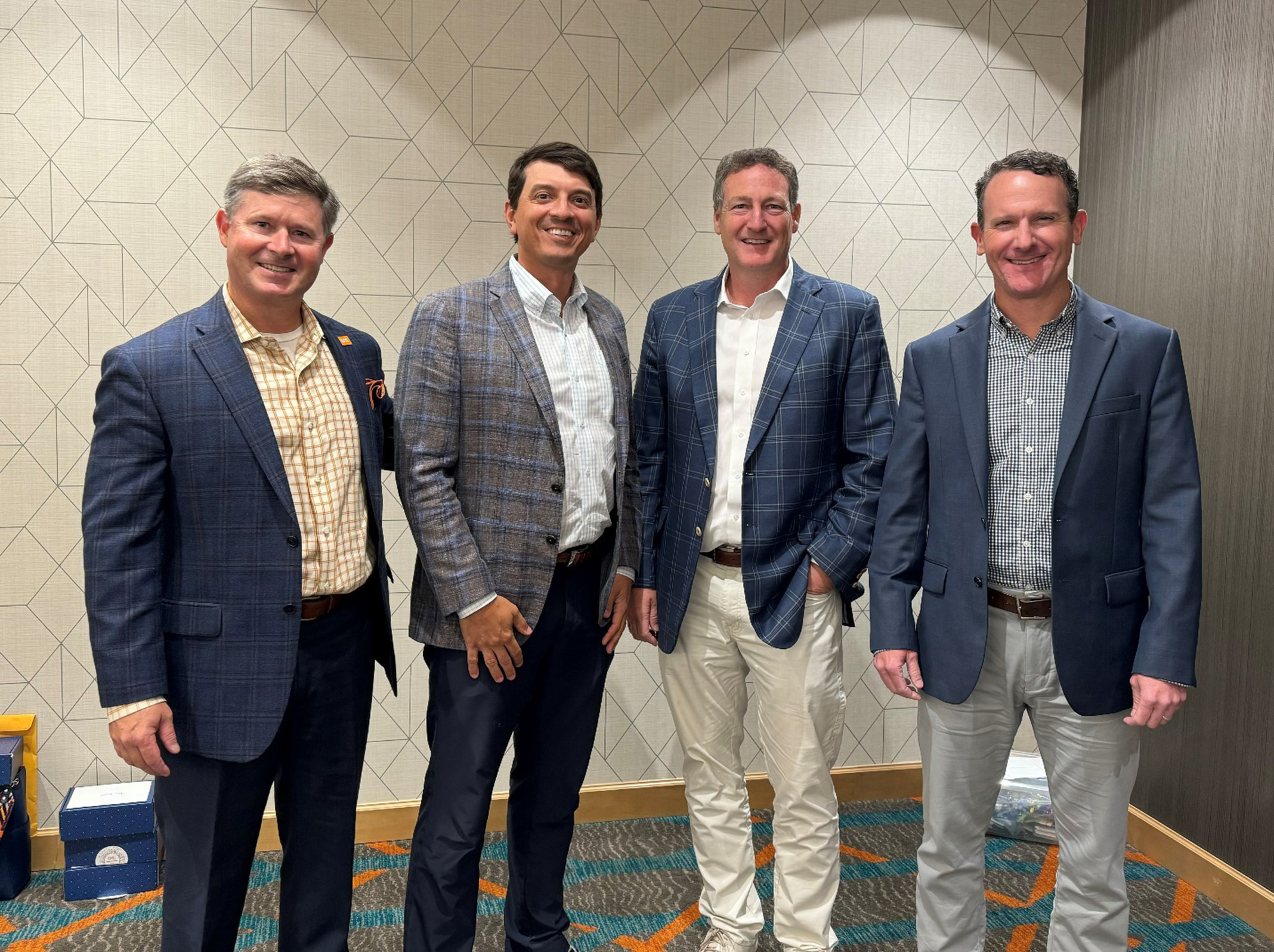 Businessmen in suits standing for photo