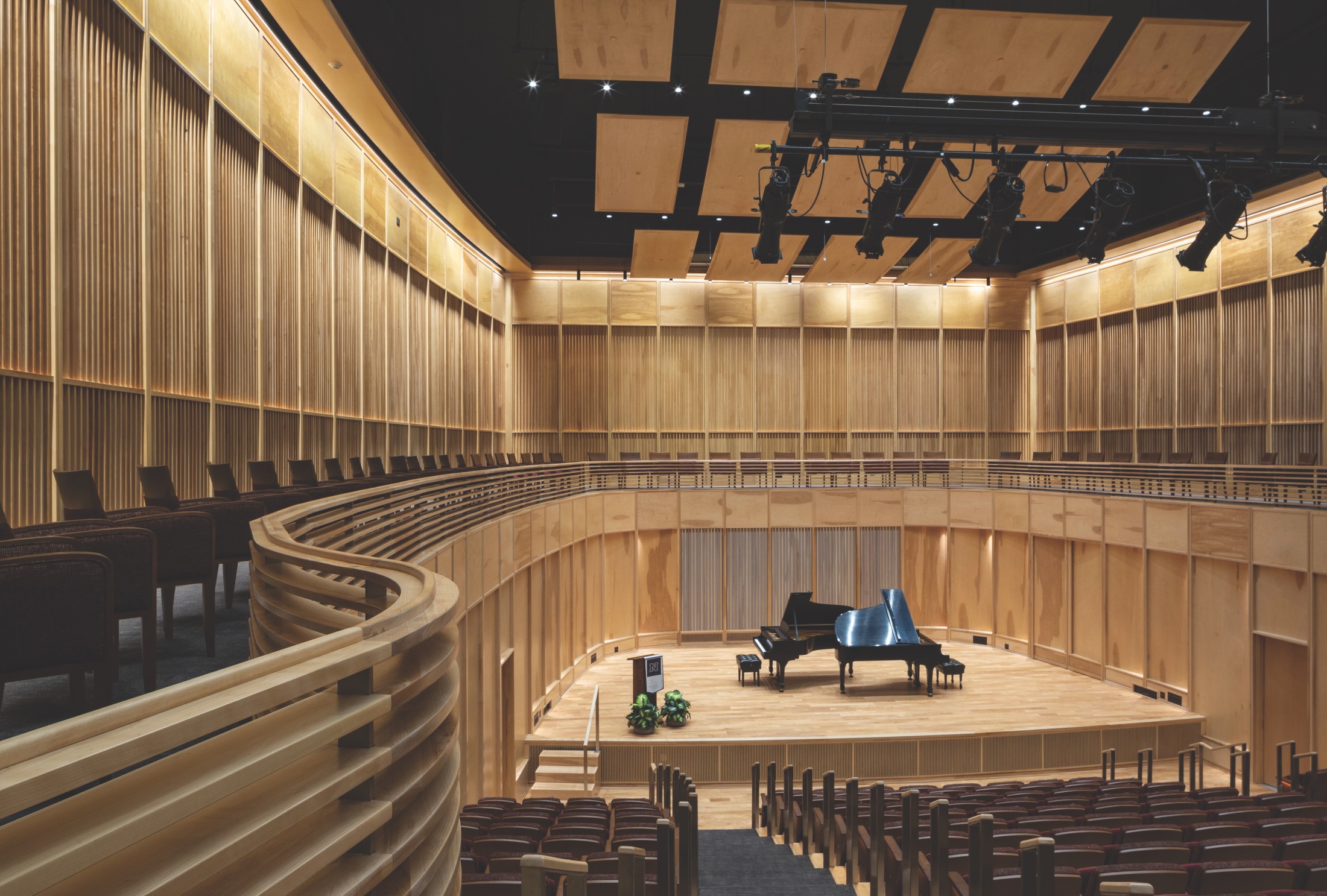 For the University of Nevada, Reno’s University Arts Building, architect DLR Group designed a narrow bowl shape that creates reverberation and the effect of being enveloped by sound.