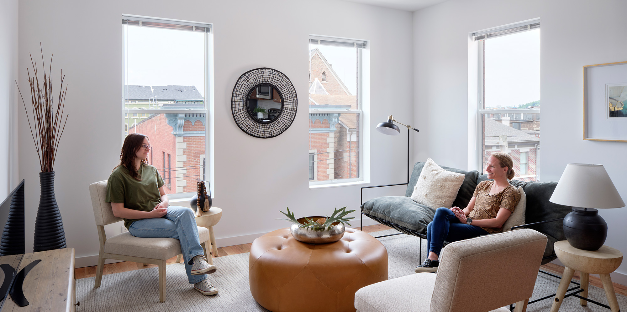 Two women in modern affordable housing unit