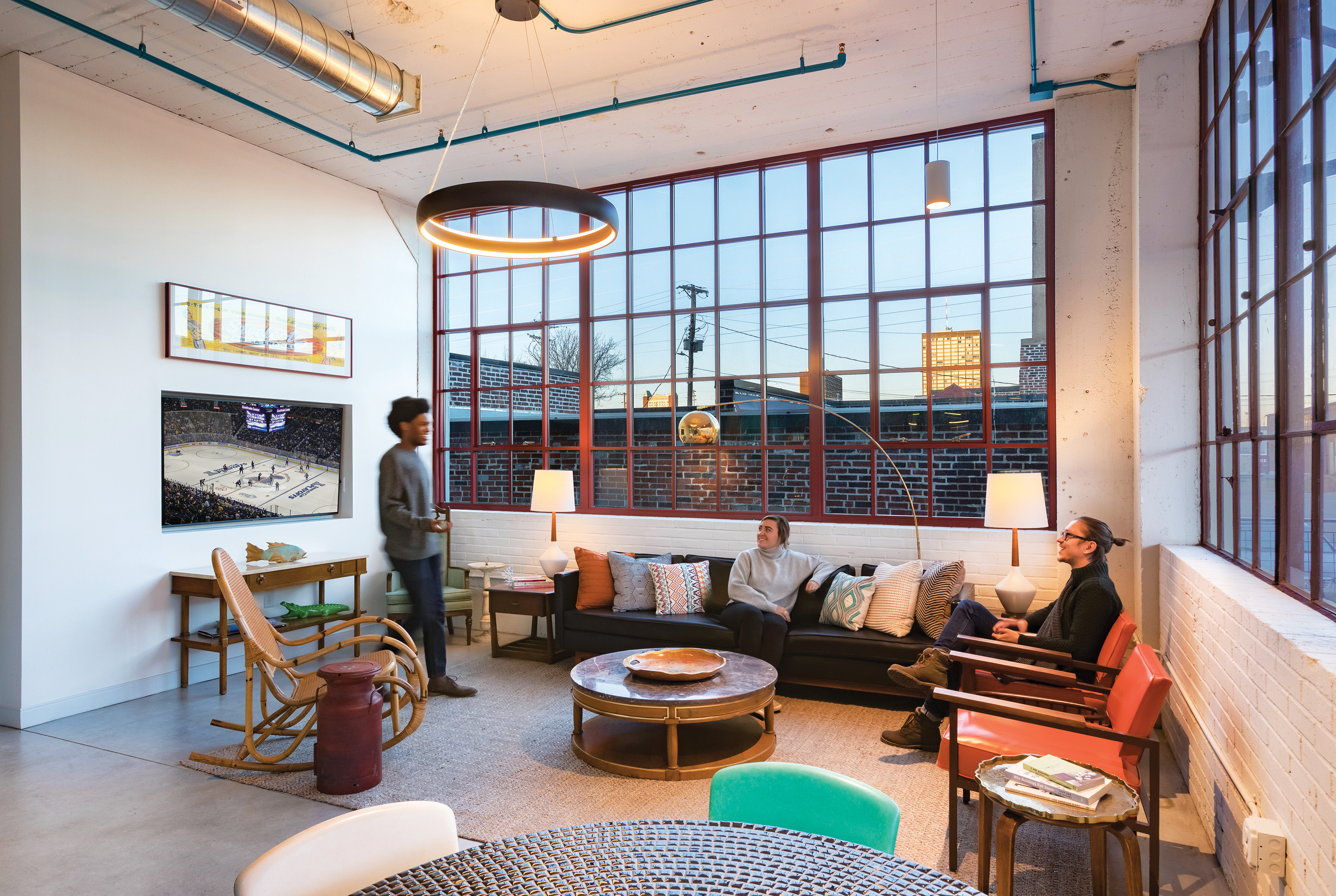 Young people gathered in loft living space