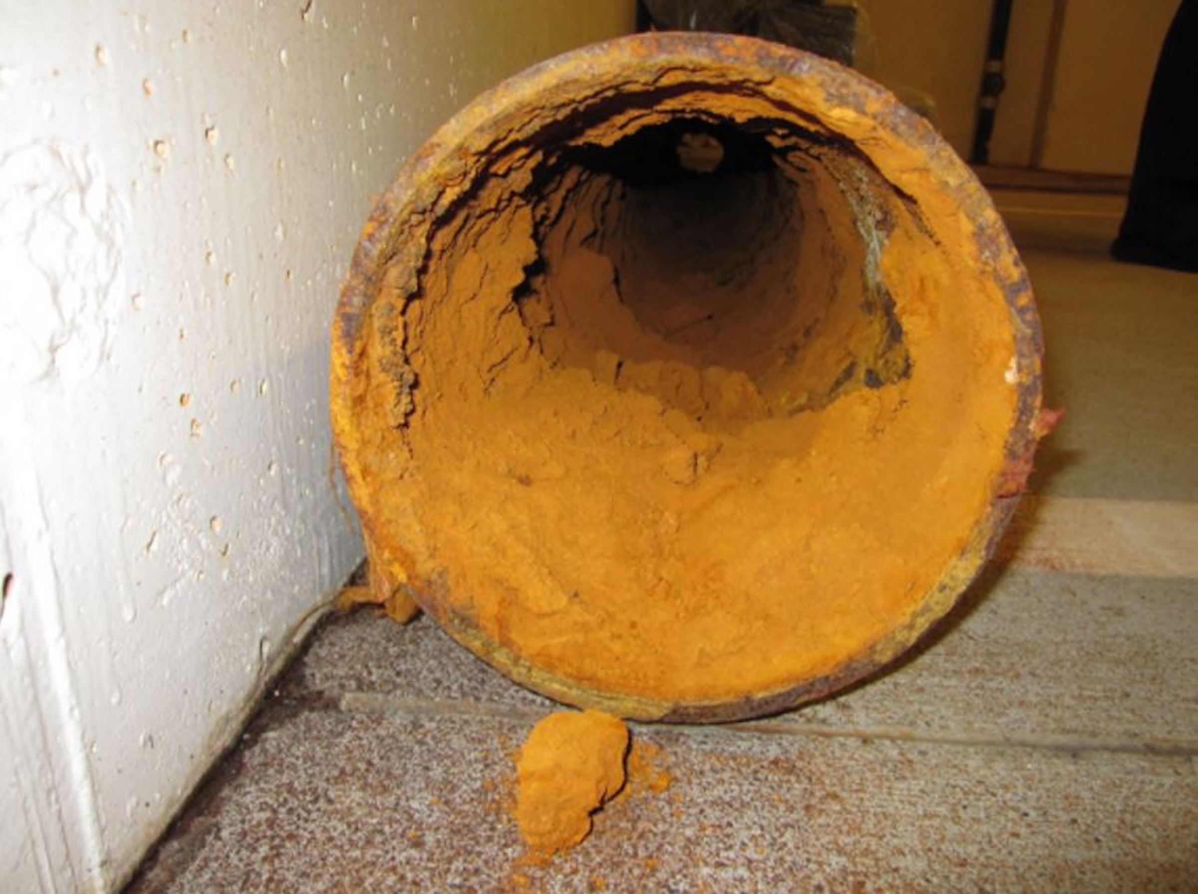 Figure 3 – Iron Ochre Buildup in Sub-Grade Drainage System Pipe