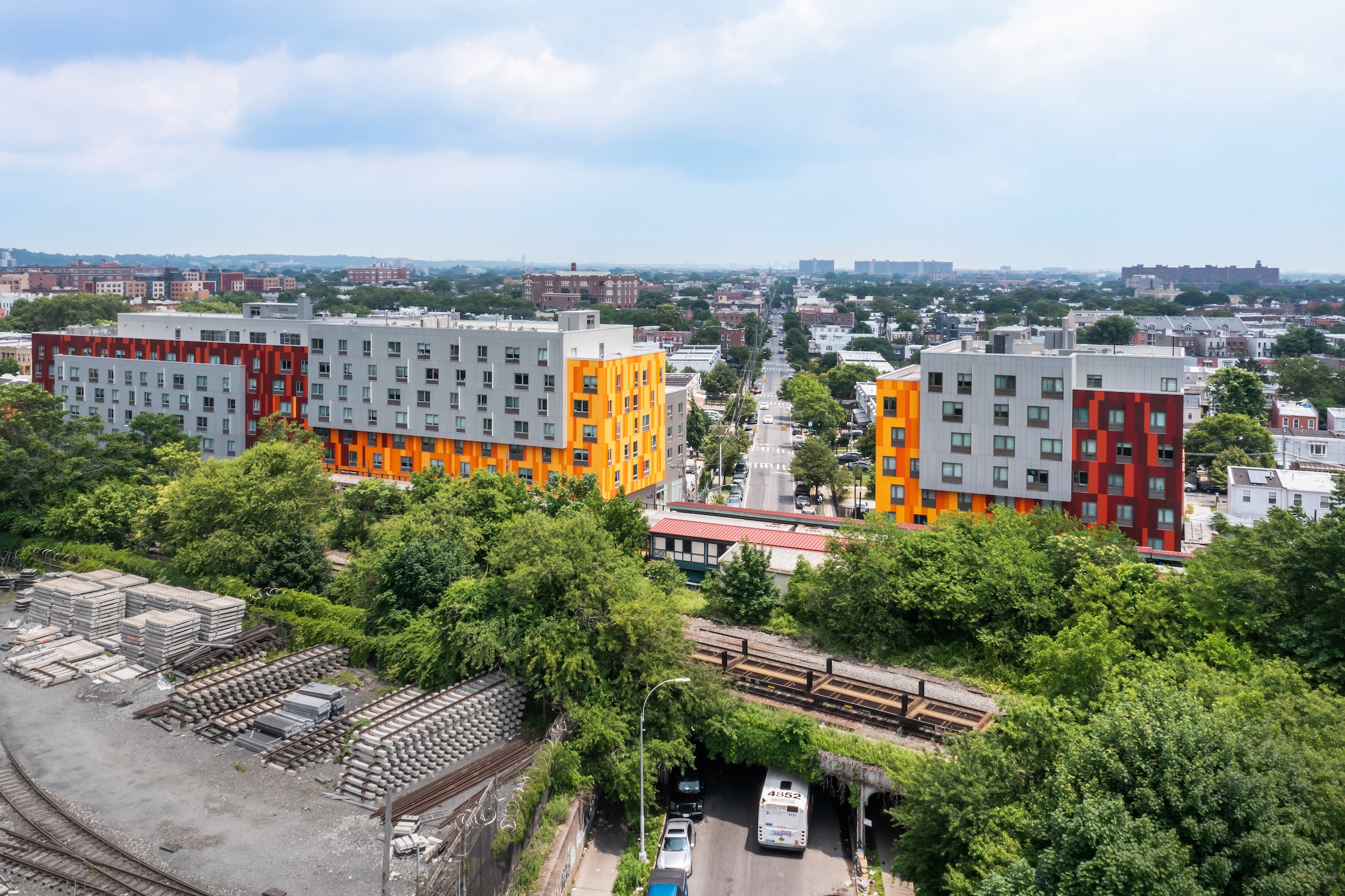 Brooklyn's colorful Van Sinderen Plaza affordable housing project includes retail, public spaces. Photo courtesy GLUCK+