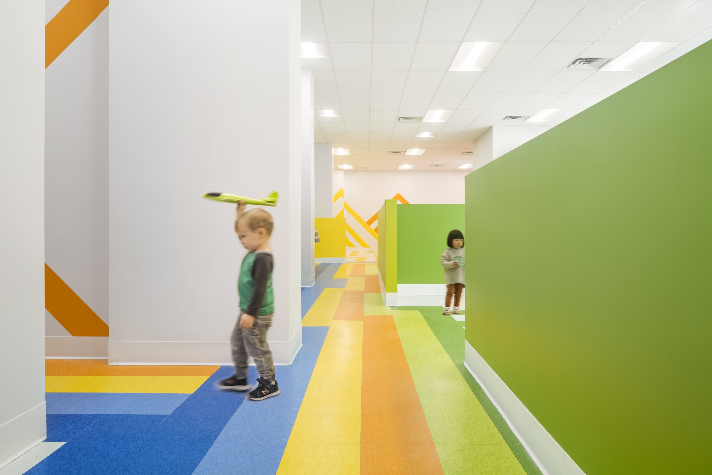 Brooklyn's colorful Van Sinderen Plaza affordable housing project includes retail, public spaces. Photo courtesy GLUCK+