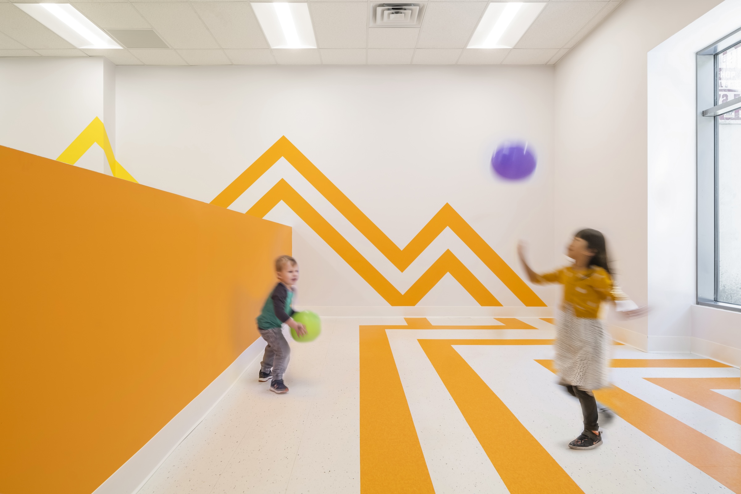 Brooklyn's colorful Van Sinderen Plaza affordable housing project includes retail, public spaces. Photo courtesy GLUCK+