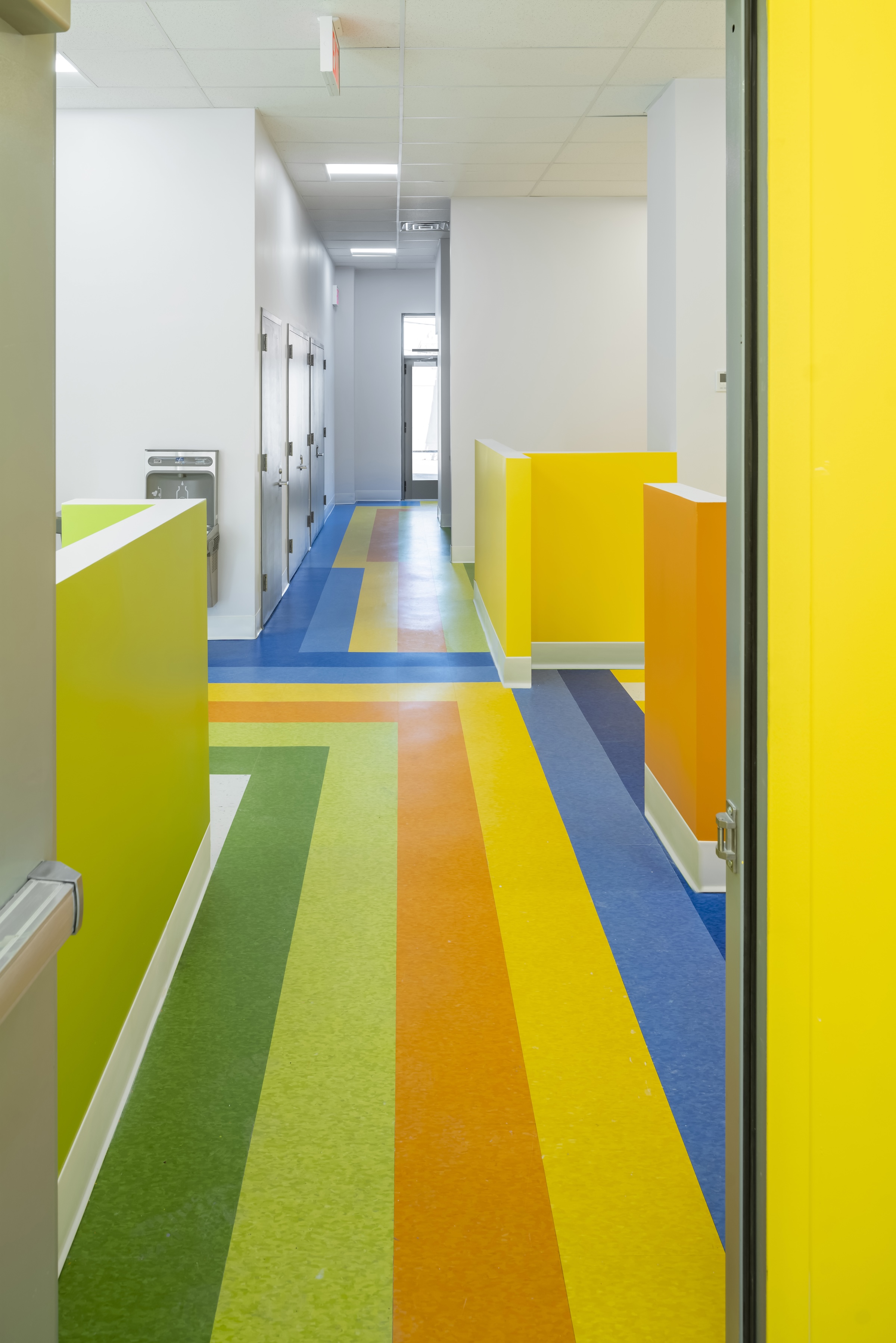 Brooklyn's colorful Van Sinderen Plaza affordable housing project includes retail, public spaces. Photo courtesy GLUCK+