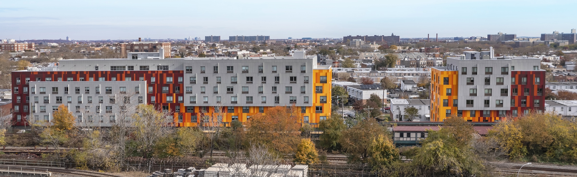 Brooklyn's colorful Van Sinderen Plaza affordable housing project includes retail, public spaces. Photo courtesy GLUCK+