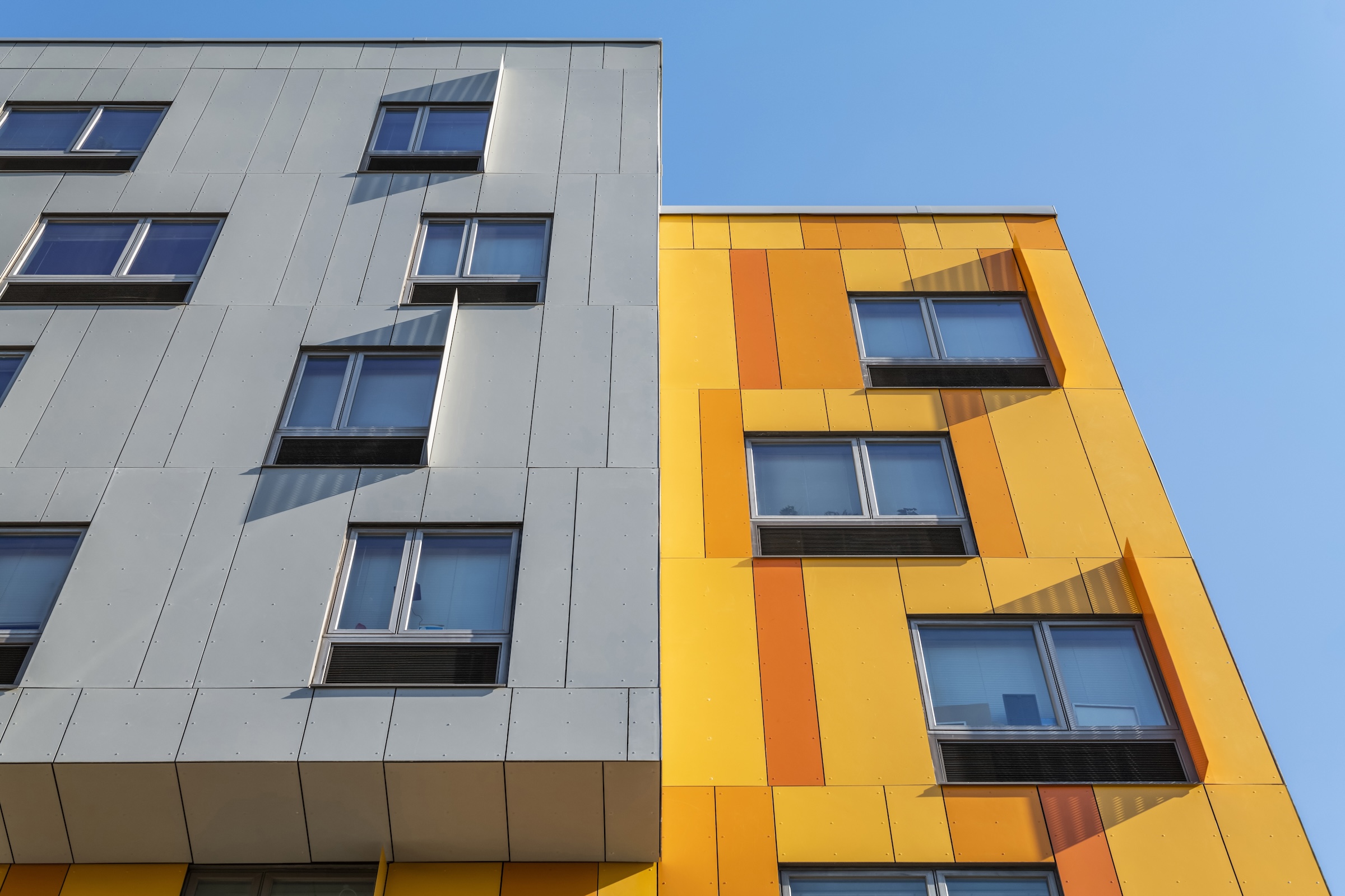 Brooklyn's colorful Van Sinderen Plaza affordable housing project includes retail, public spaces. Photo courtesy GLUCK+