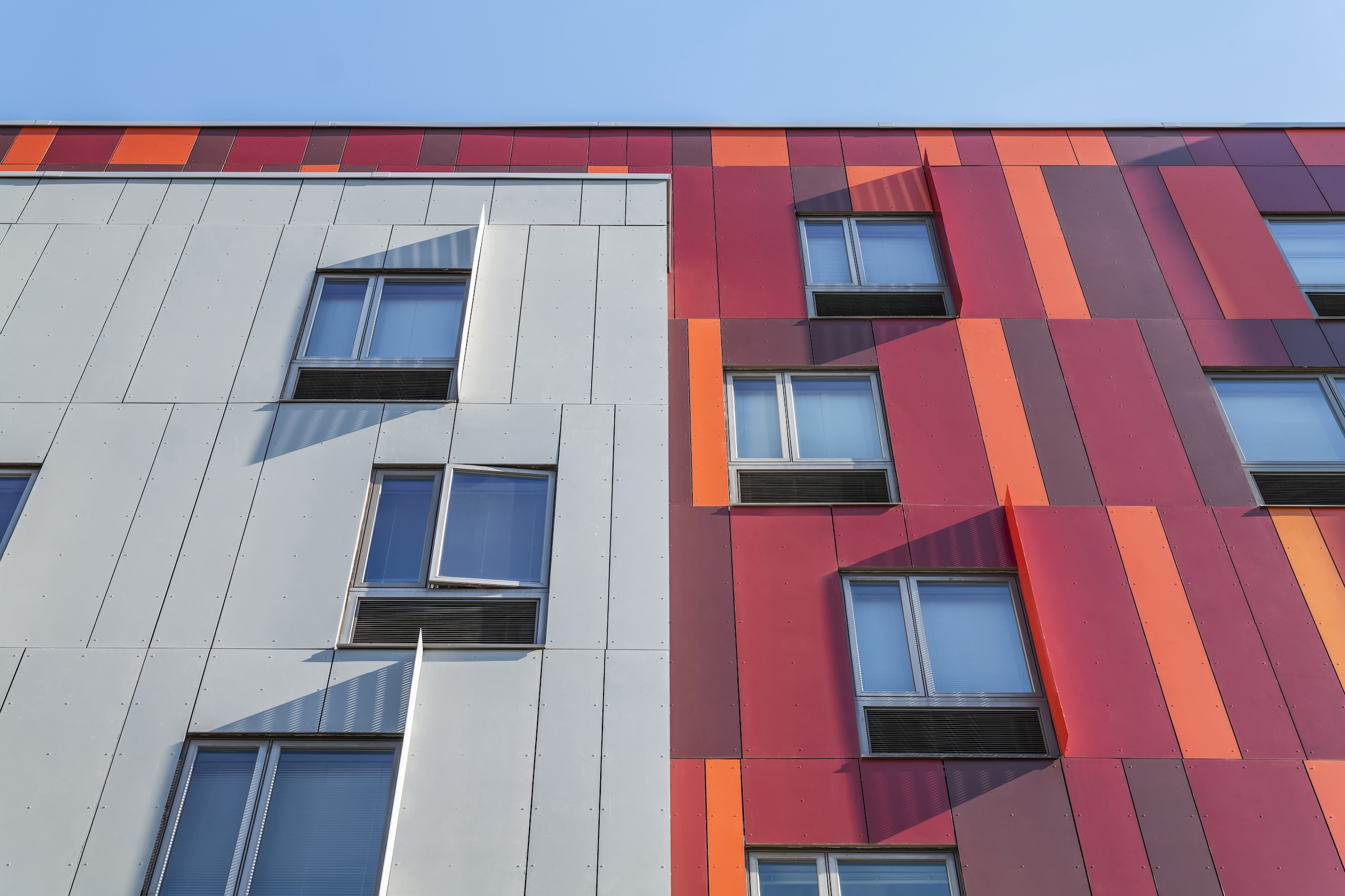 Brooklyn's colorful Van Sinderen Plaza affordable housing project includes retail, public spaces. Photo courtesy GLUCK+