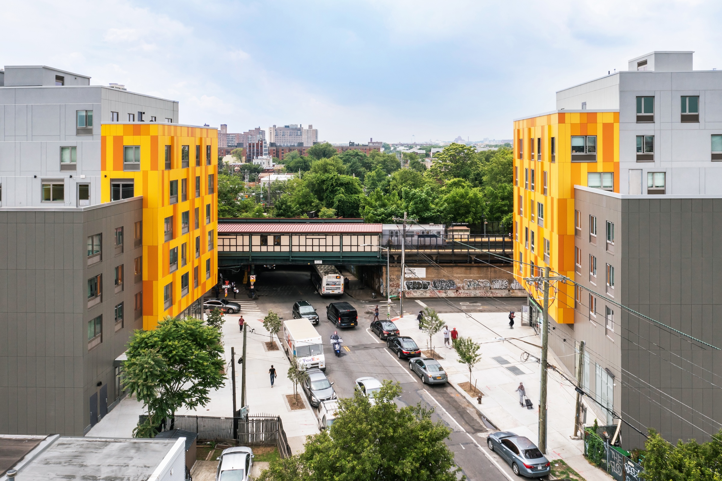 Brooklyn's colorful Van Sinderen Plaza affordable housing project includes retail, public spaces. Photo courtesy GLUCK+