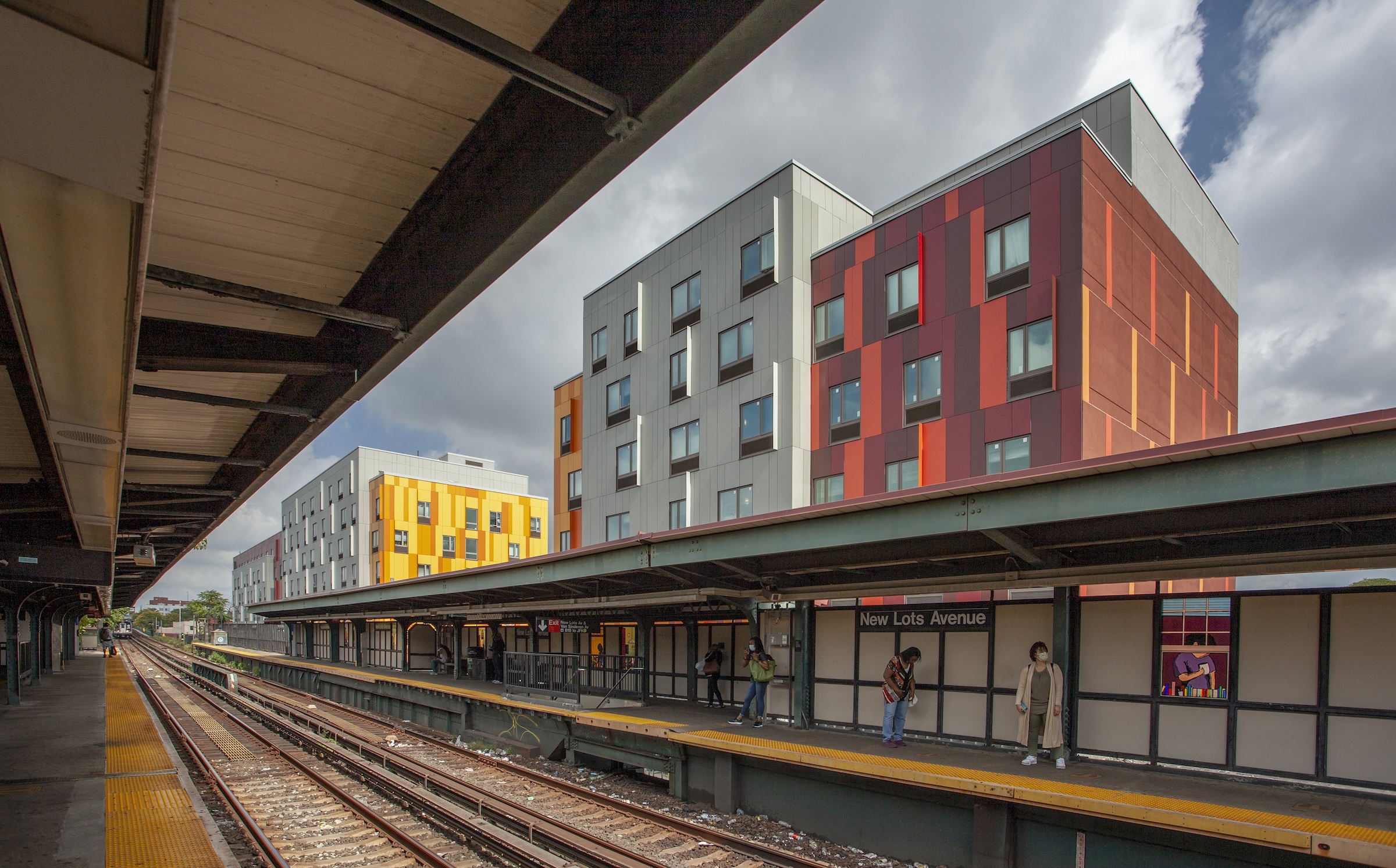 Brooklyn's colorful Van Sinderen Plaza affordable housing project includes retail, public spaces. Photo courtesy GLUCK+