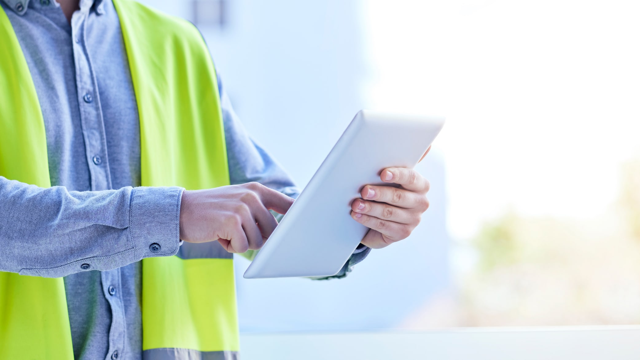 Construction worker holding iPad