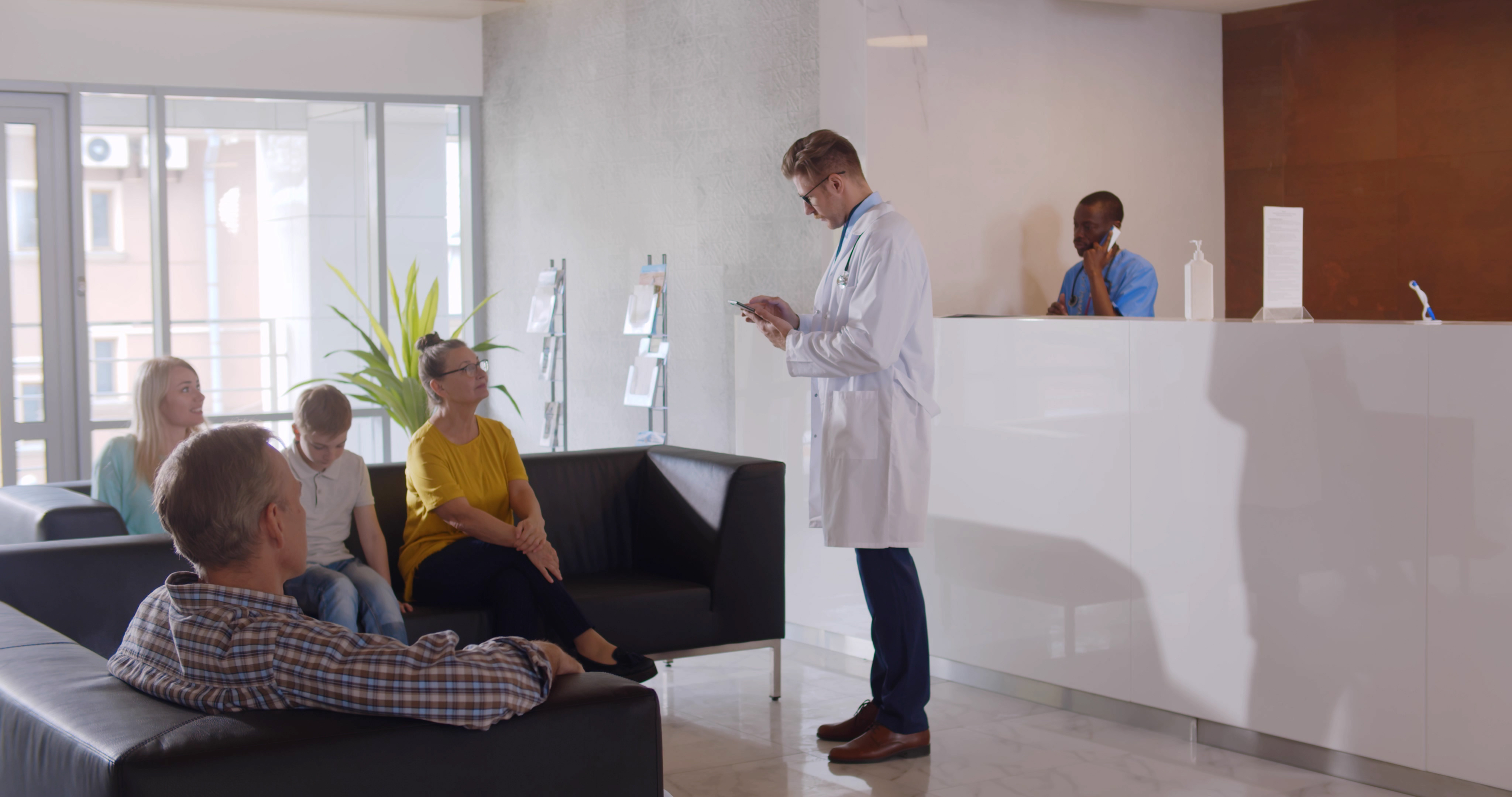 Reception area showing doctor and patients