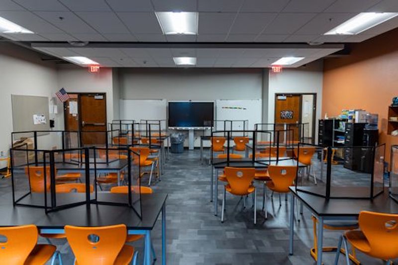 New classroom with plexiglass dividers to protect students and teachers from Covid virus.