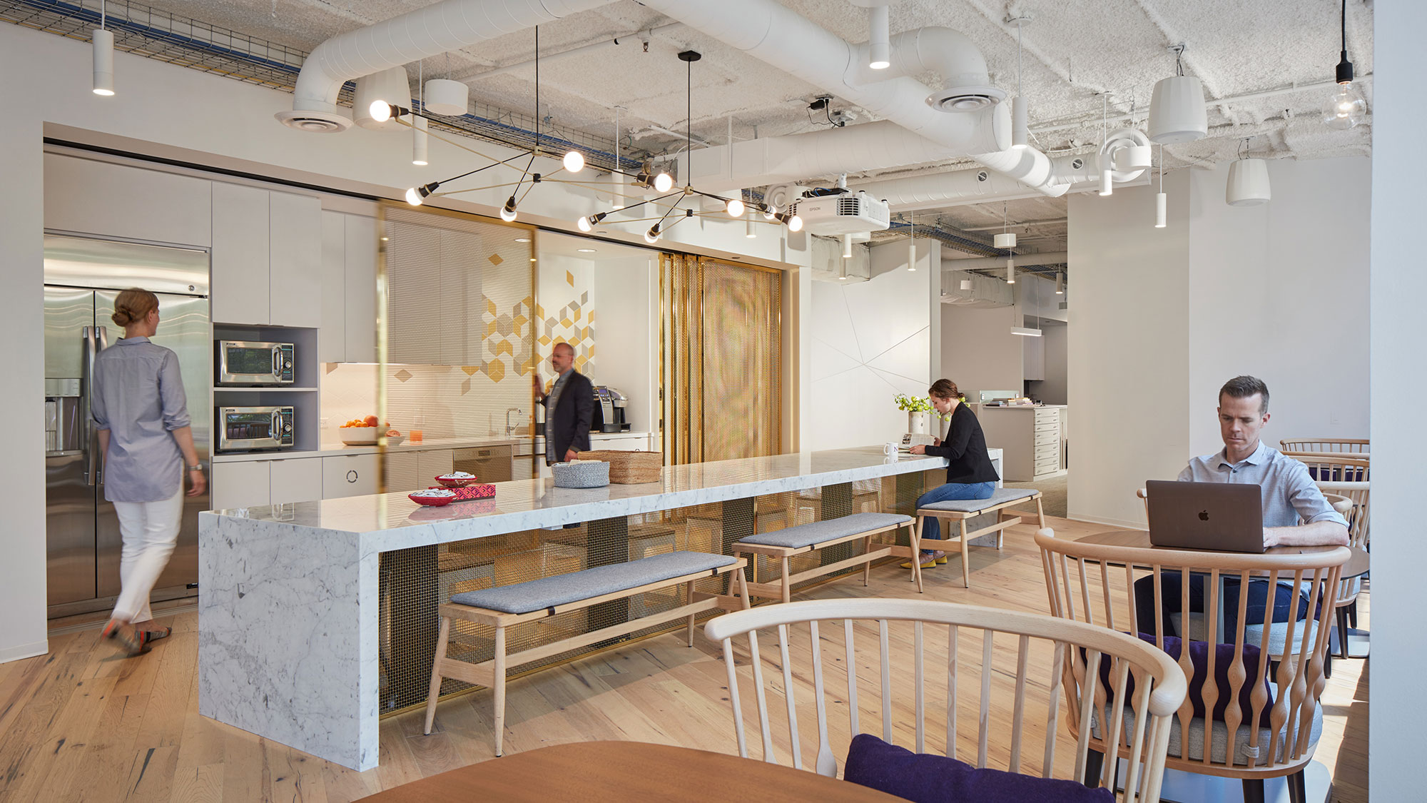 Staff working inside an academic workplace cafe.