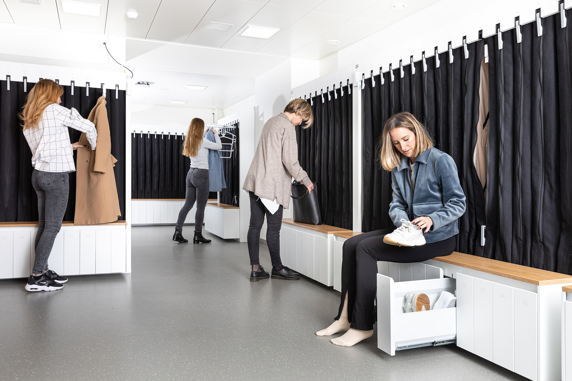 Women in locker room with smart storage