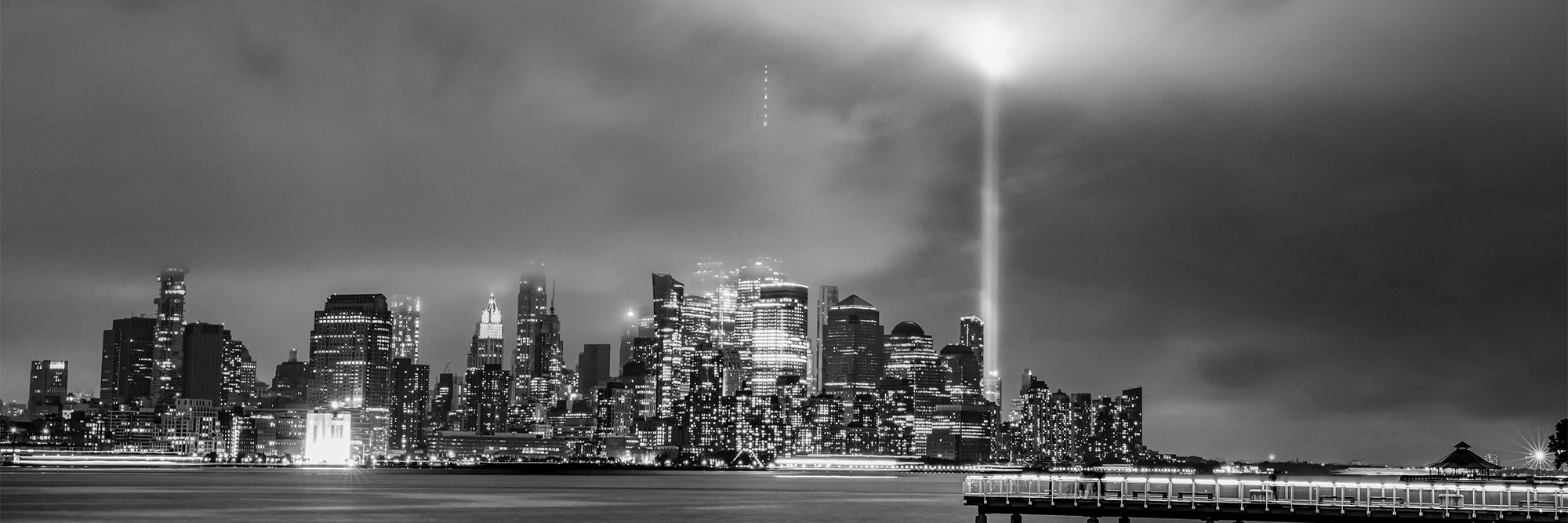 Black and White Photograph of a City Waterfront at Storm